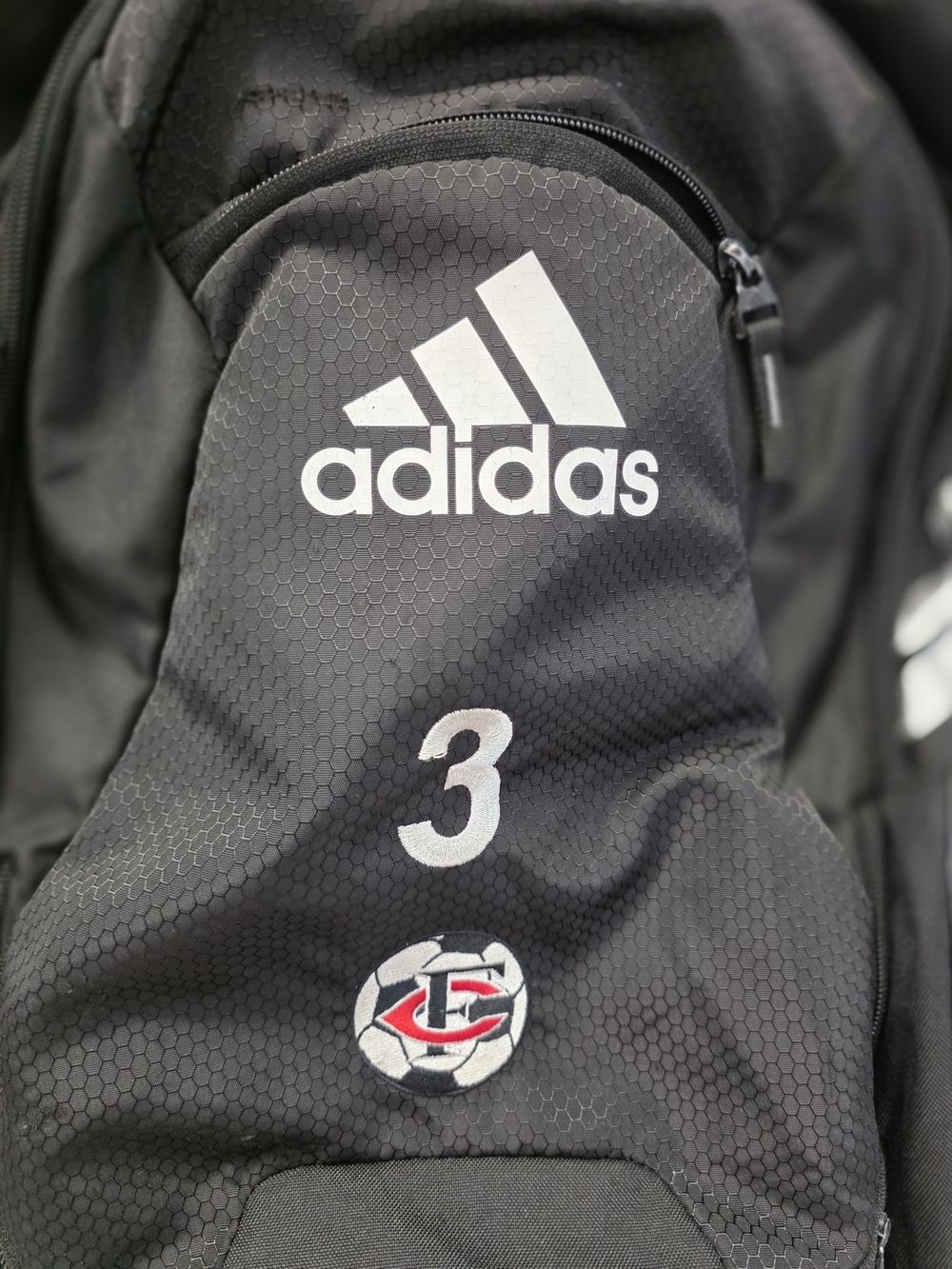 adidas Black Backpack with White Logo and Red Accent